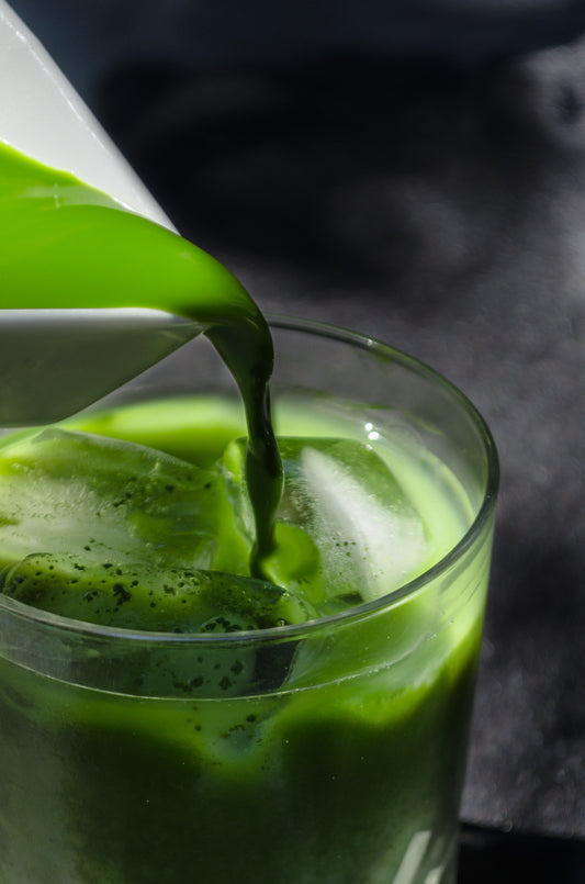 Matcha green tea pouring over ice